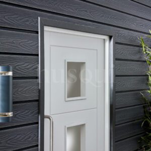 White front door with black trim and grey cladding